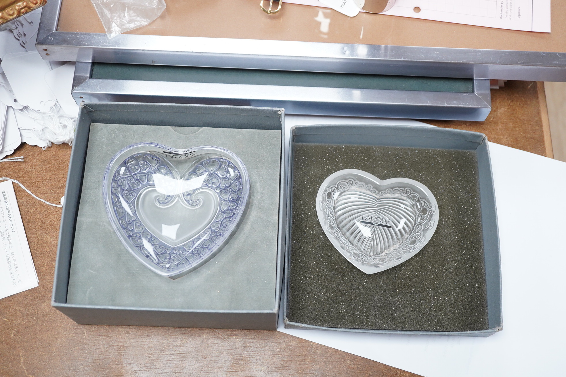 Two modern Lalique glass pin dishes in the form of hearts, largest 11cm wide. Condition - good